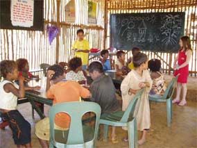 Children and teacher together w Nanita